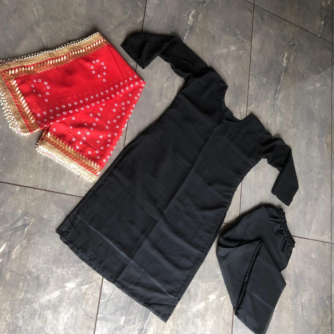 Black georgette salwar suit with red dupatta