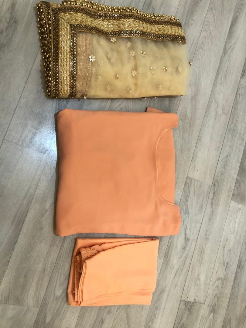Light orange salwar suit with heavy dupatta