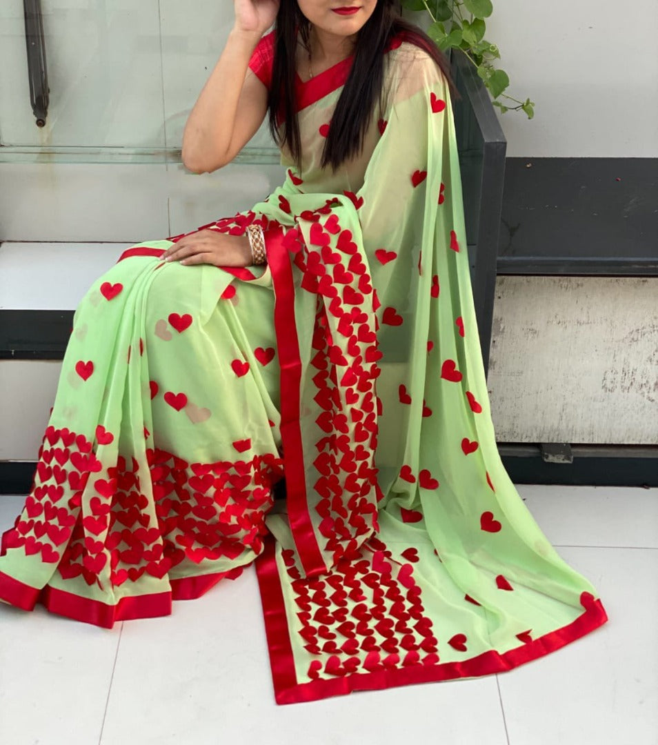 Baby pink georgette heart embellished saree