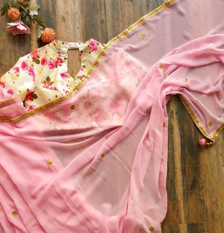 Baby pink georgette saree with floral printed blouse