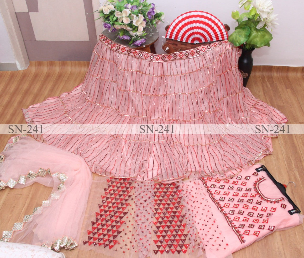 Baby pink mono net heavy embroidered wedding lehenga choli