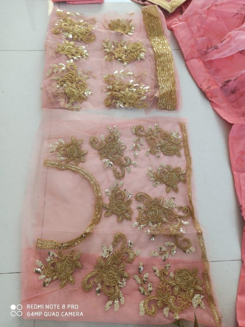 Baby pink organza printed lehenga with heavy work blouse