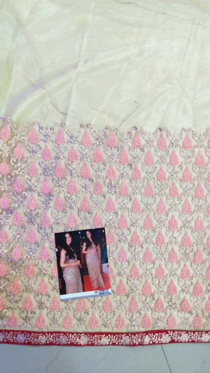 Beige mono net heavy embroidered ceremonial saree