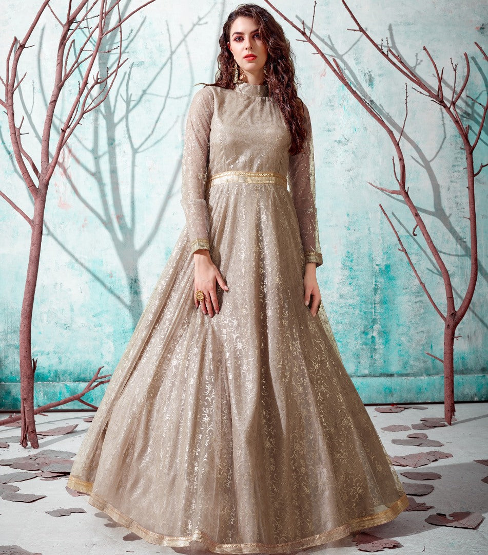 Beige net metallic foil work party wear designer gown