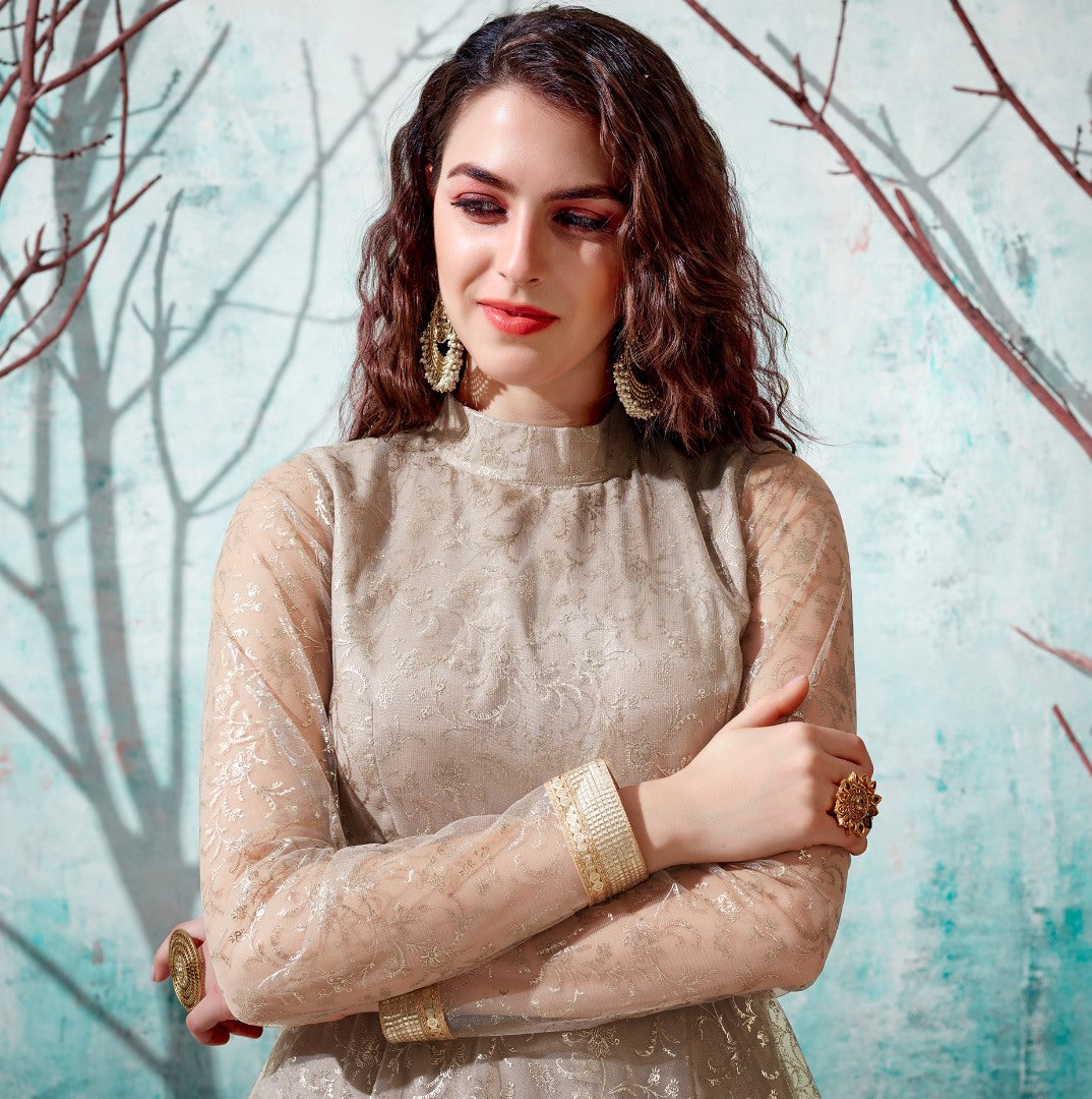 Beige net metallic foil work party wear designer gown