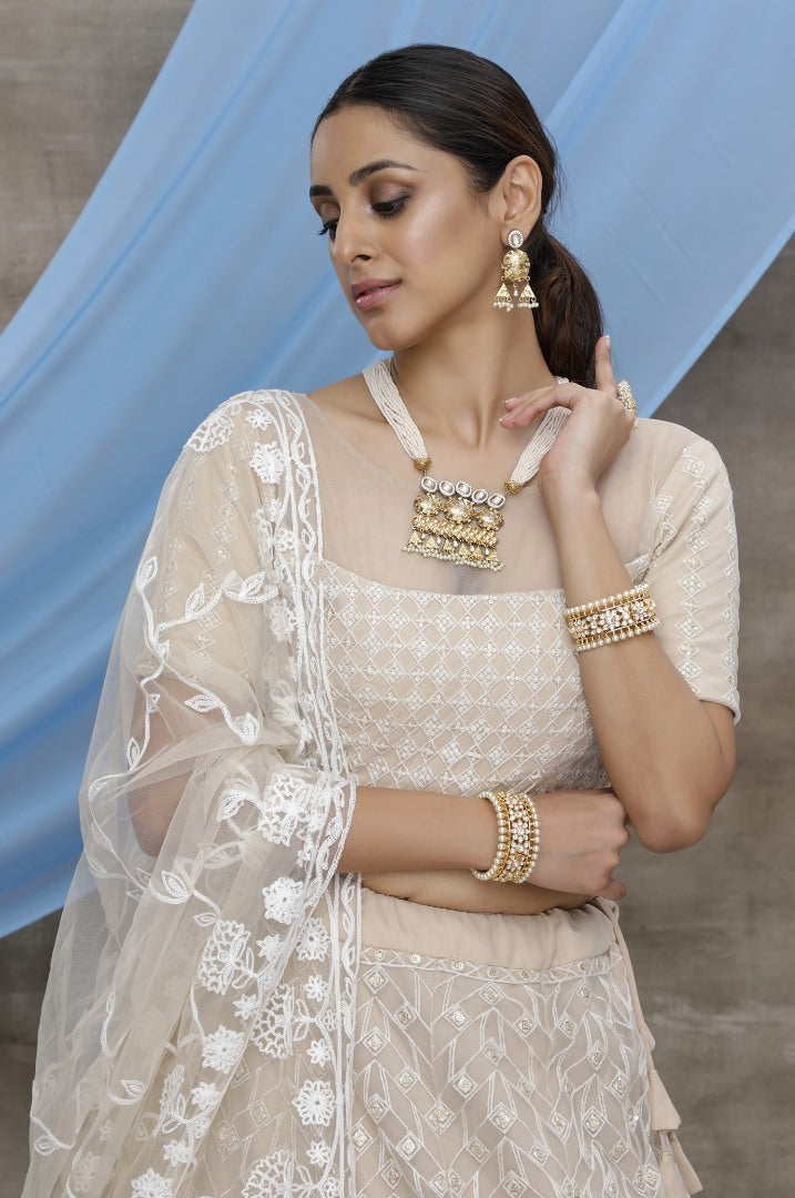 Beige net sequence embroidered party wear lehenga choli