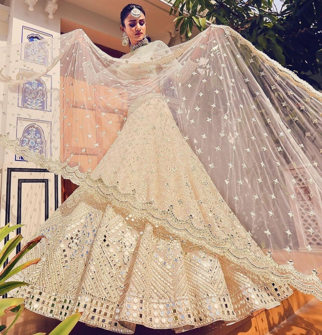 Beige soft heavy net paper mirror and thread work bridal lehenga choli
