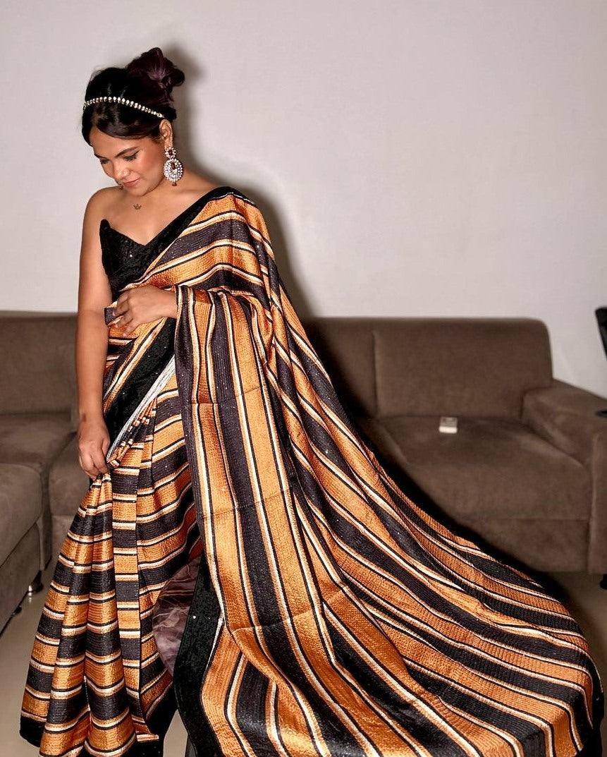 Black and orange print and sequence work party wear saree