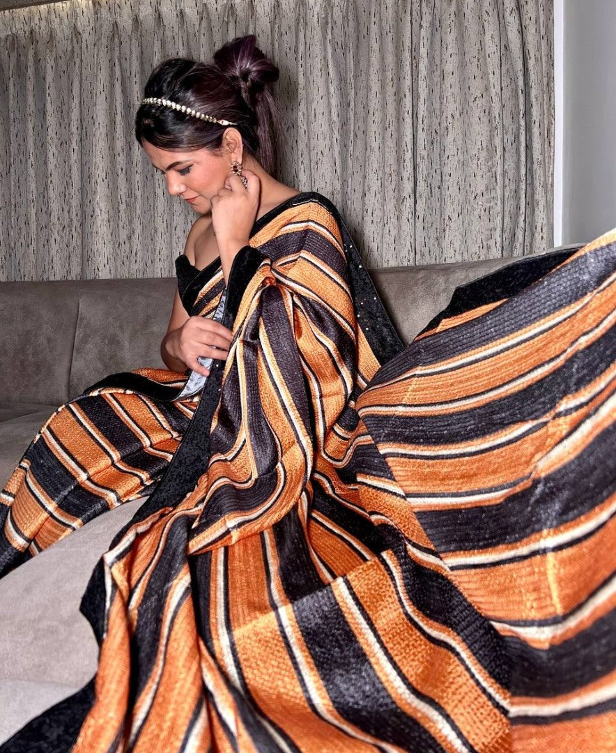 Black and orange print and sequence work party wear saree