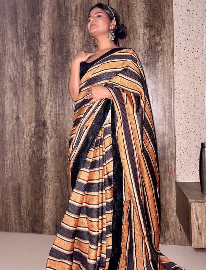 Black and orange print and sequence work party wear saree