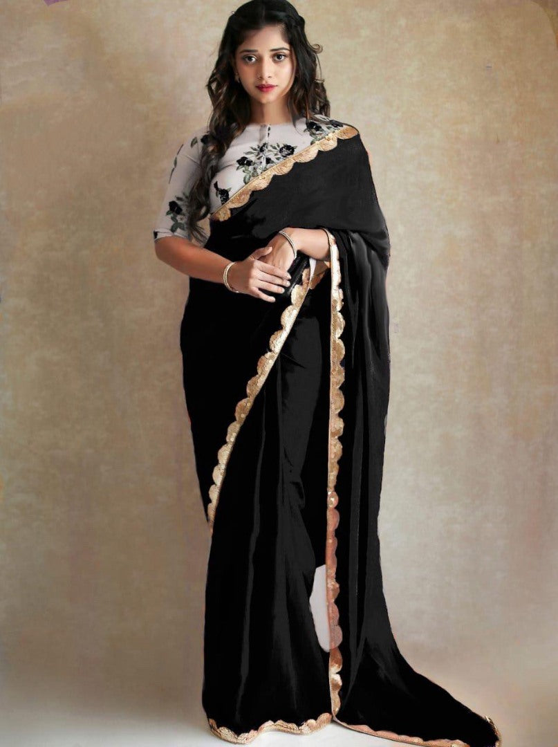 Black georgette partywear saree with sequence work gold border