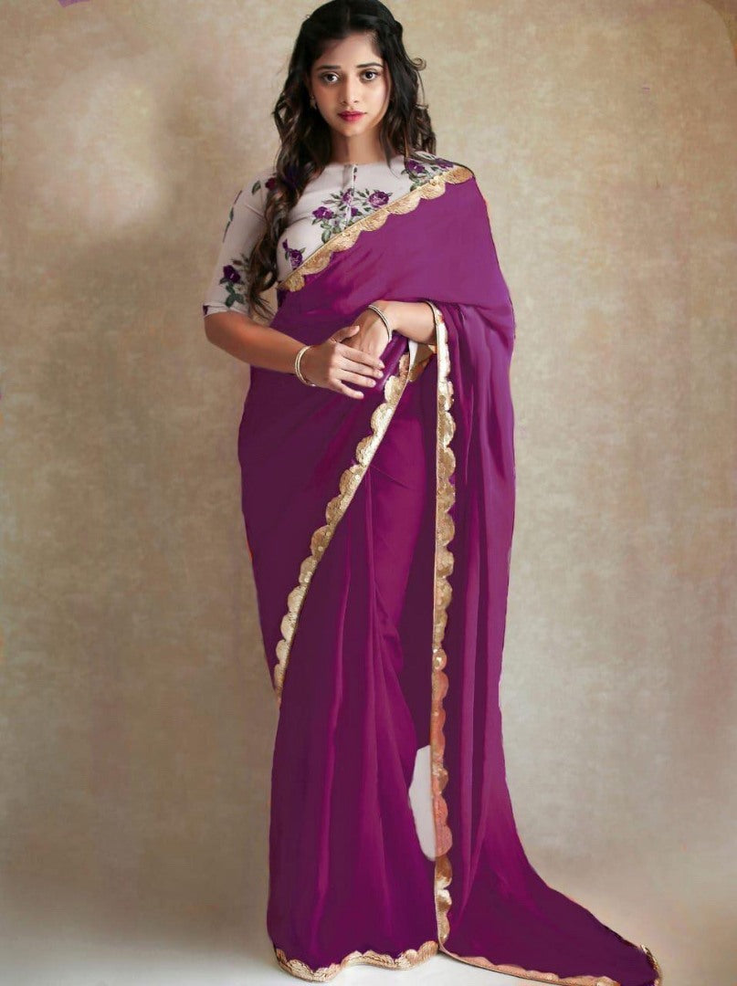 Black georgette partywear saree with sequence work gold border