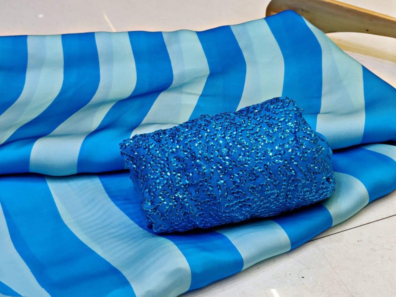 Blue and skyblue stripe satin georgette partywear saree