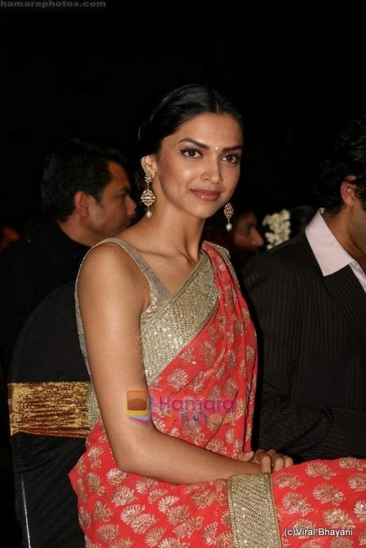 bollywood style orange embroidered saree