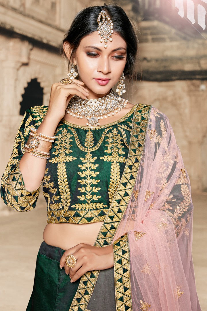 Dark green pure tapeta silk heavy embroidered wedding lehenga