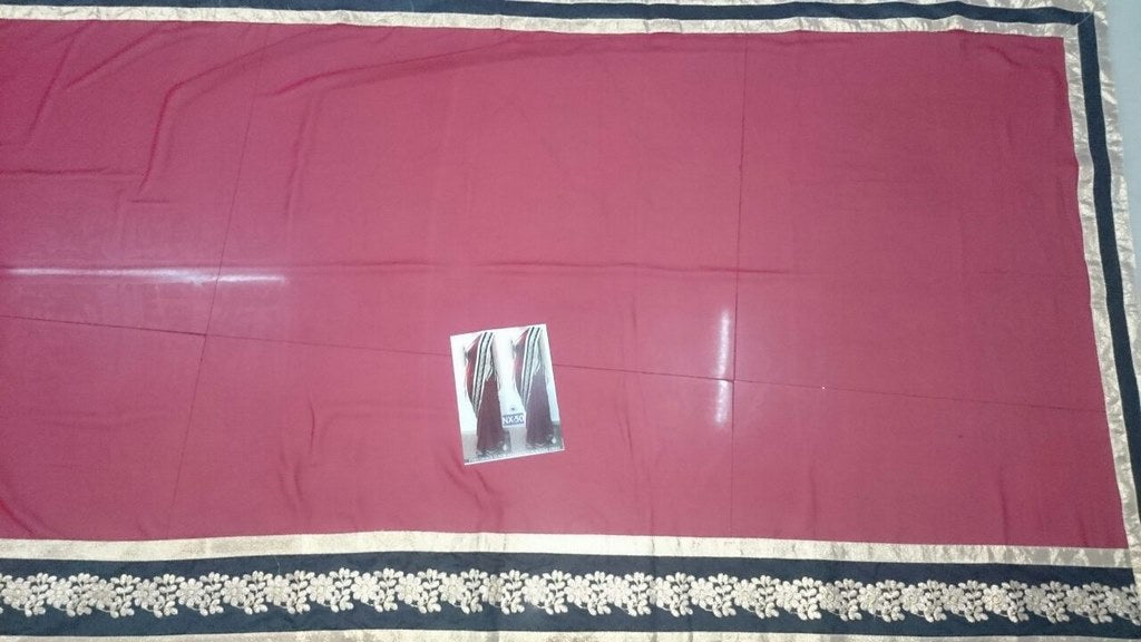 Gorgeous red saree with black embroidered lace