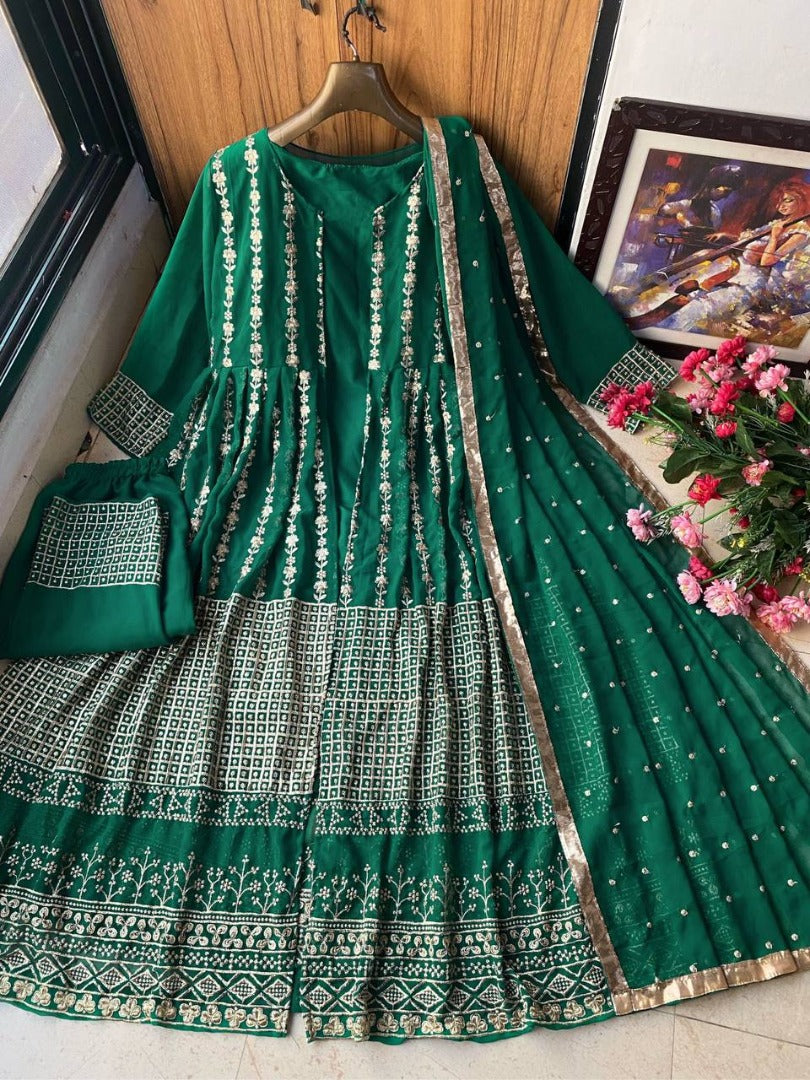 Green heavy embroidery worked salwar suit with shrug