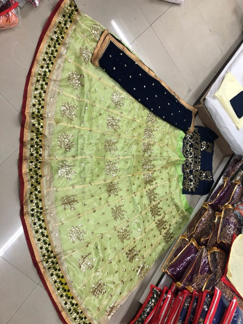 Green net embroidered sequence work wedding lehenga