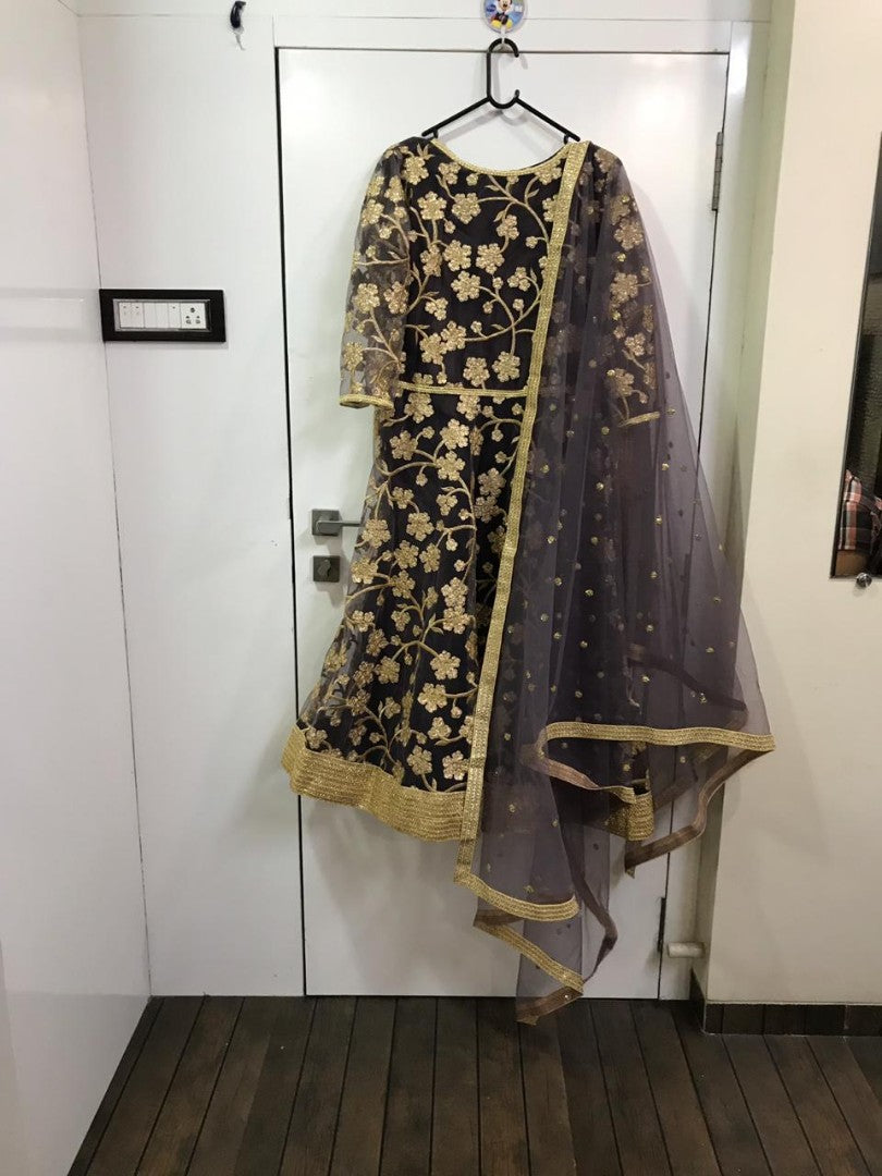 Grey net beautiful embroidered anarkali suit