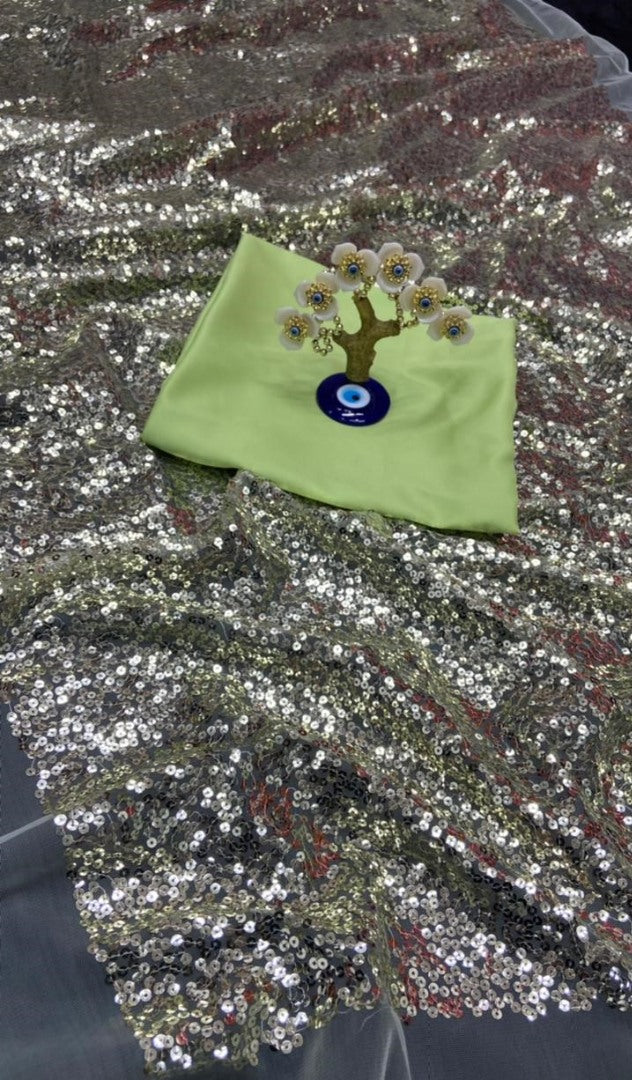 Light green heavy nylon net all over sequence work saree