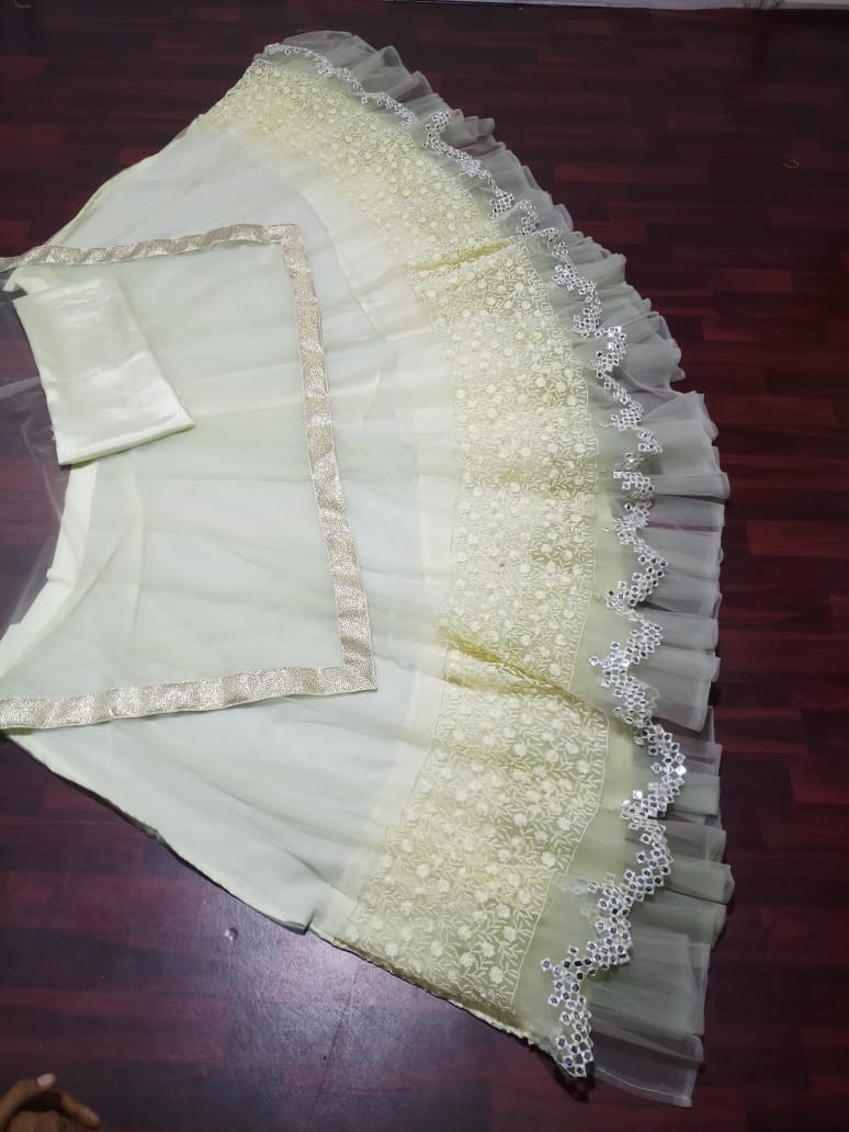 Light pista green soft net fabulous partywear lehenga