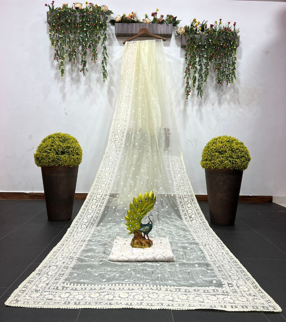 Light yellow organza silk heavy thread embroidery work saree for ceremony
