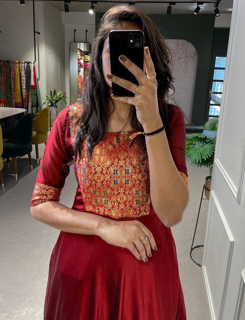 Maroon rangoli silk weaving work gown