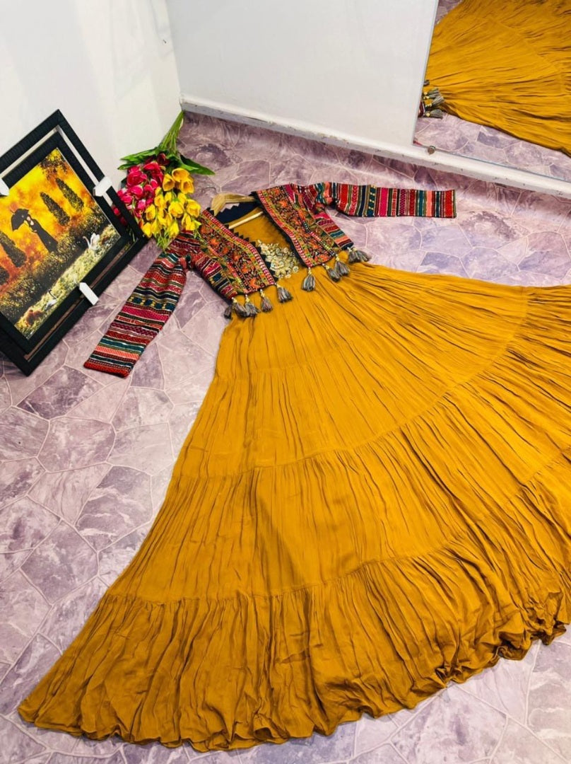 Musturd yellow georgette gown with heavy embroidered cotti