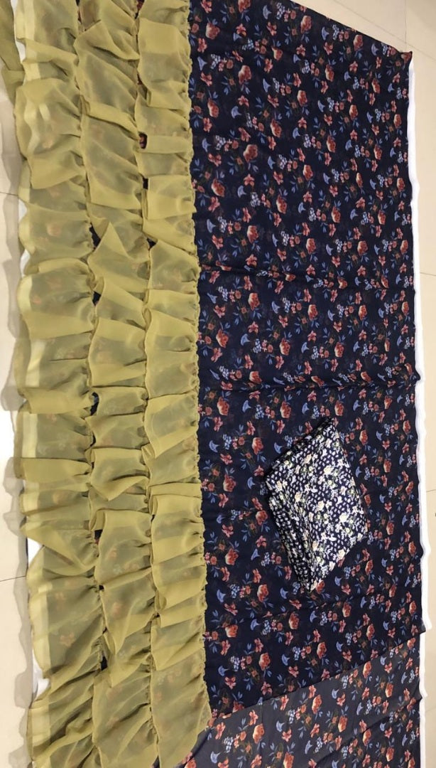Navy blue floral printed georgette saree with green ruffle border