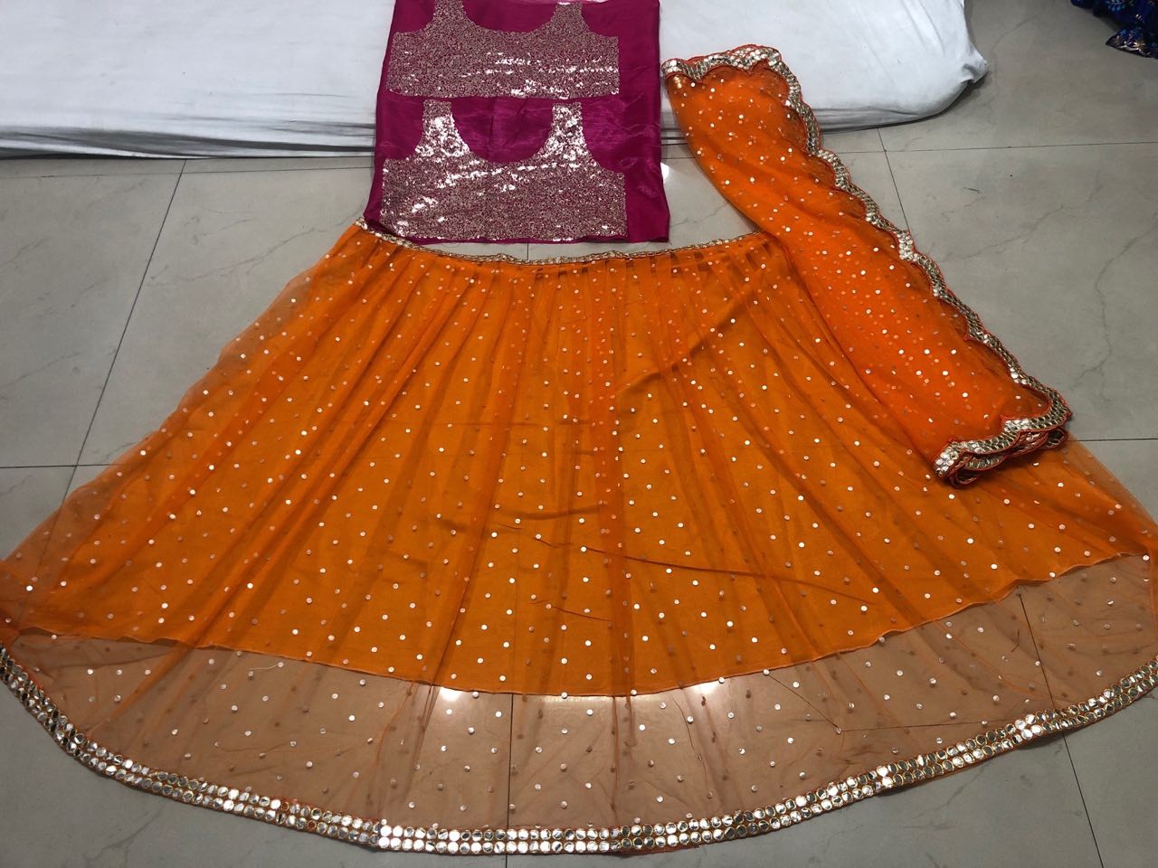 orange butterfly mono net partywear lehenga