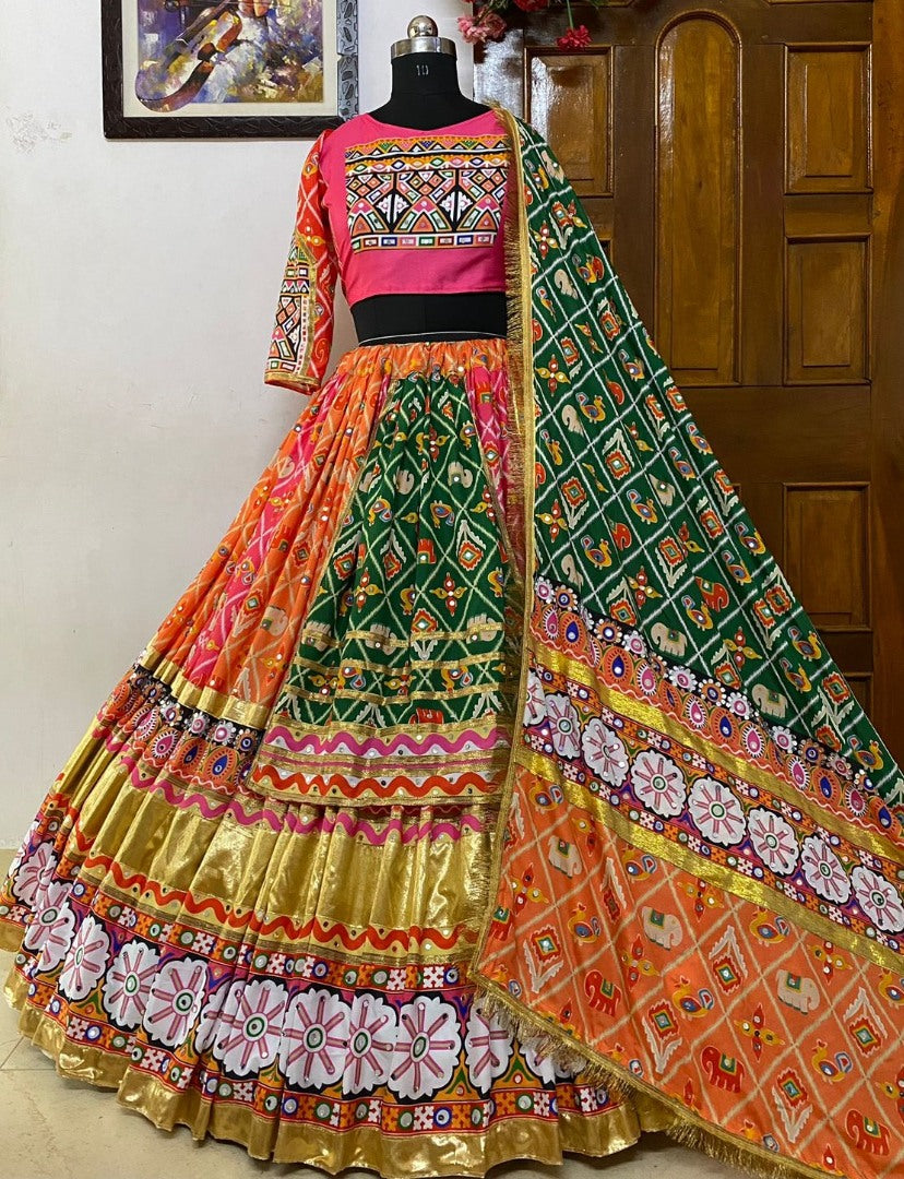 Orange pink print and mirror work gujarati garba navratri lehenga chaniya choli