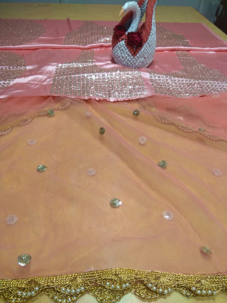 Peach soft net embroidered lehenga choli for ceremony