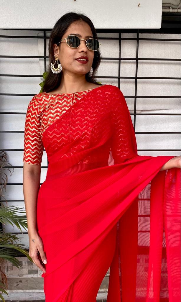 Red georgette pleated partywear saree with heavy sequence work blouse