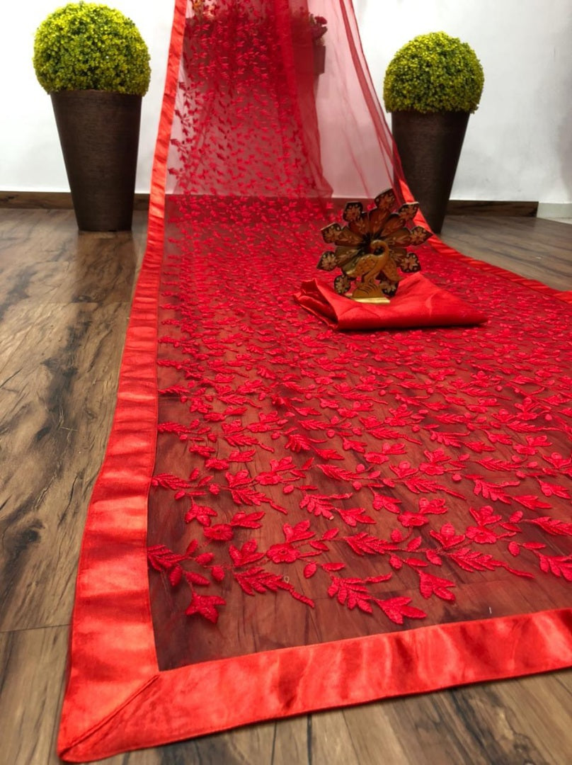 Red soft net heavy embroidered saree