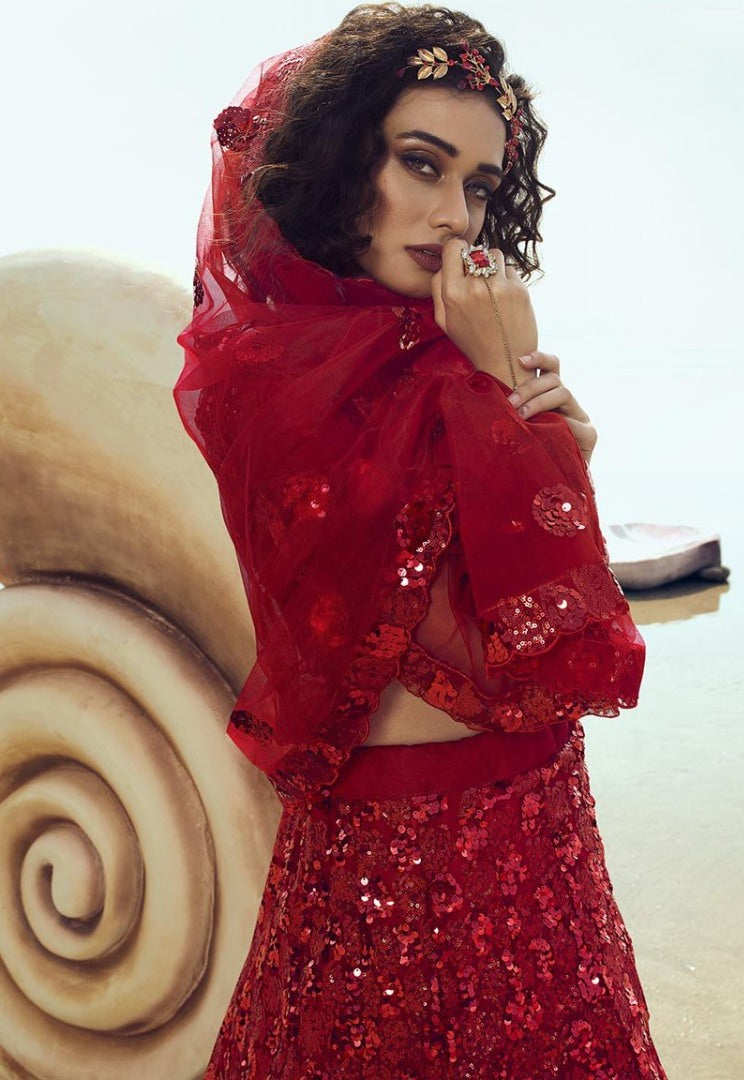 Red soft net sequence work ceremonial lehenga choli