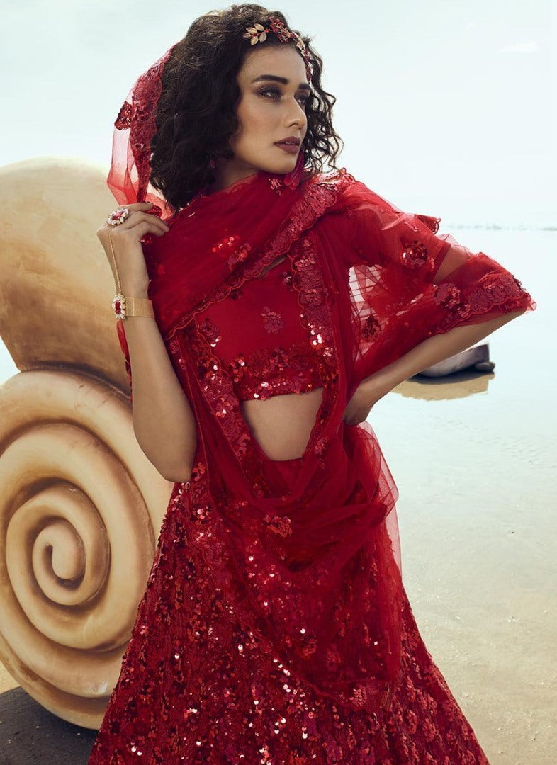 Red soft net sequence work ceremonial lehenga choli
