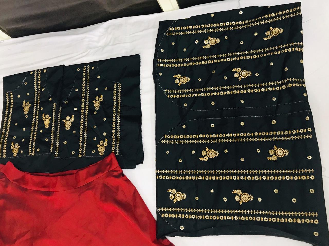 Red tapeta silk partywear lehenga with embroidered blouse