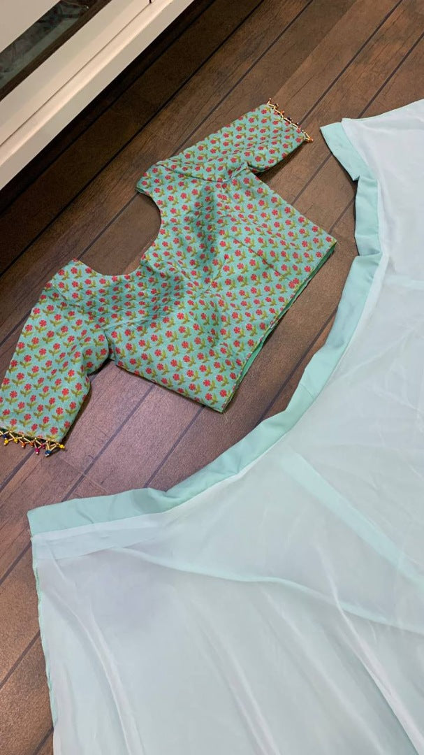 Sea green ruffle border indowestern lehenga with white embroidered shrug