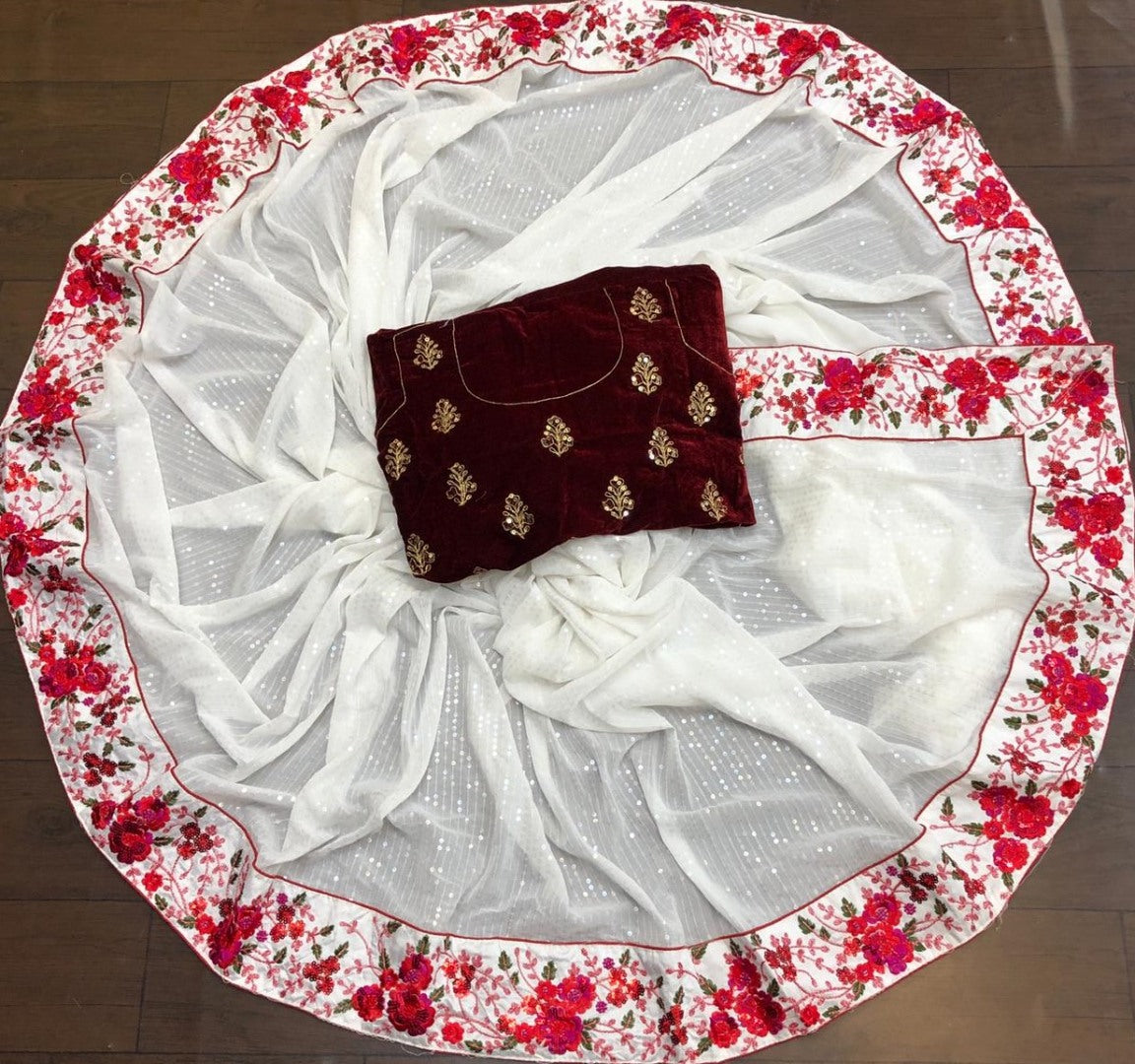 White faux georgette sequence with embroidered work ceremonial saree