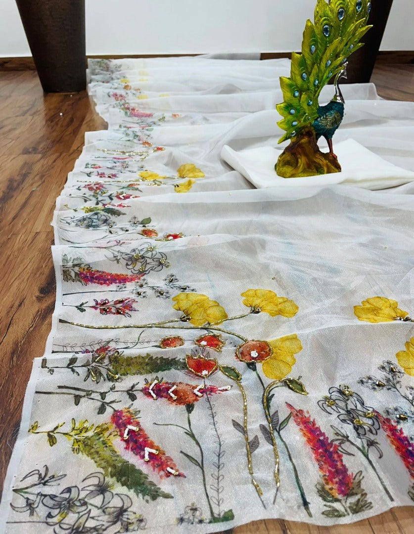 White organza print and hand worked saree