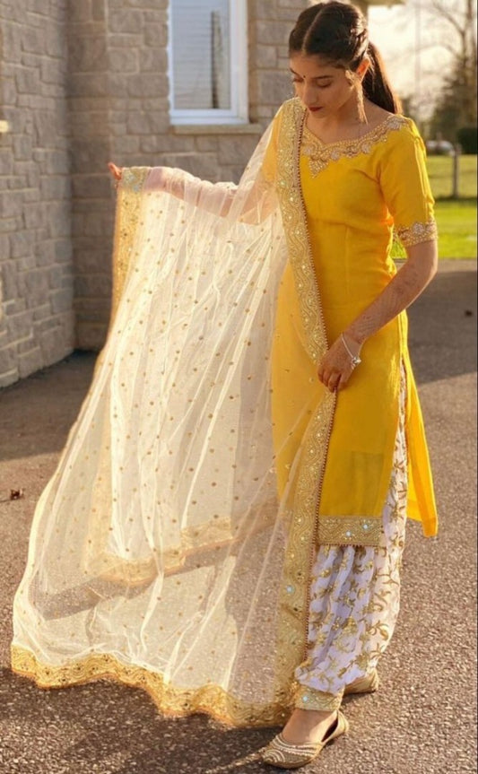 Yellow fancy thred and sequence work punjabi suit for haldi ceremony
