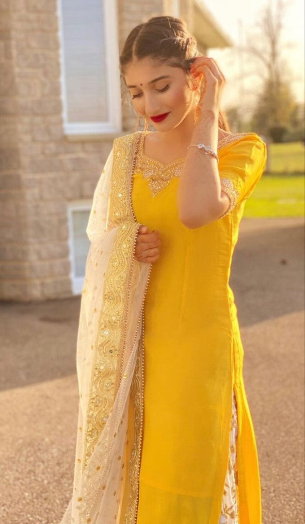 Yellow fancy thred and sequence work punjabi suit for haldi ceremony