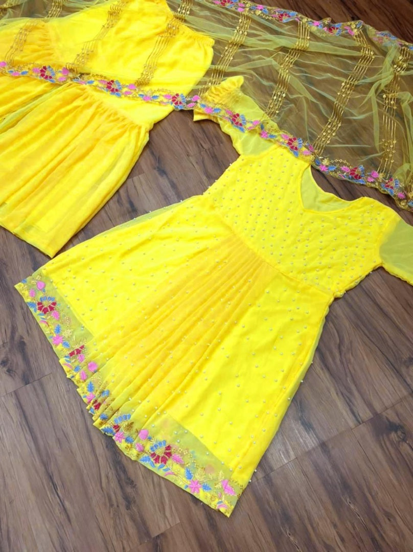 Yellow georgette embroidered and moti work sharara suit