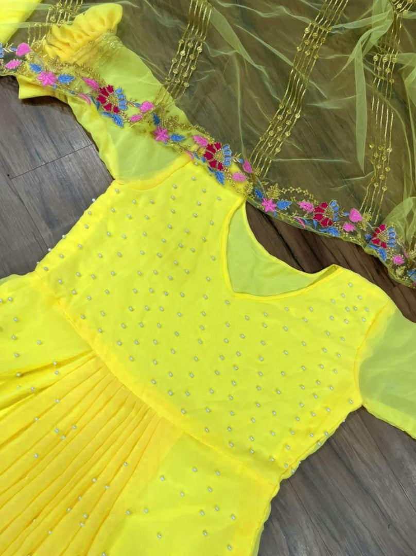 Yellow georgette embroidered and moti work sharara suit