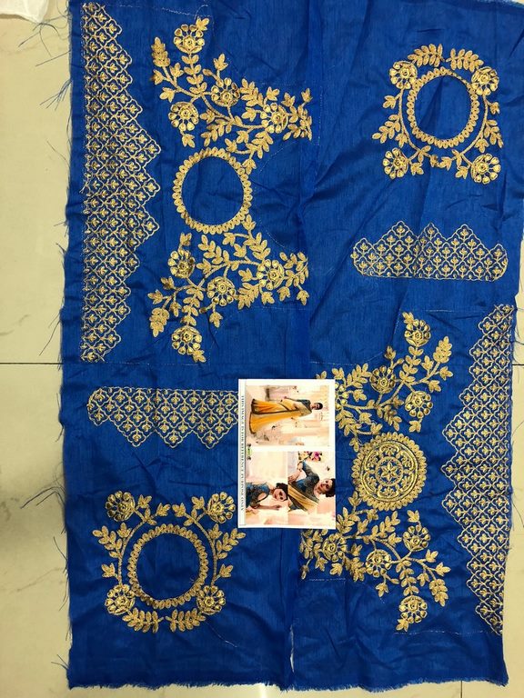 Yellow georgette embroidered wedding saree with heavy blouse