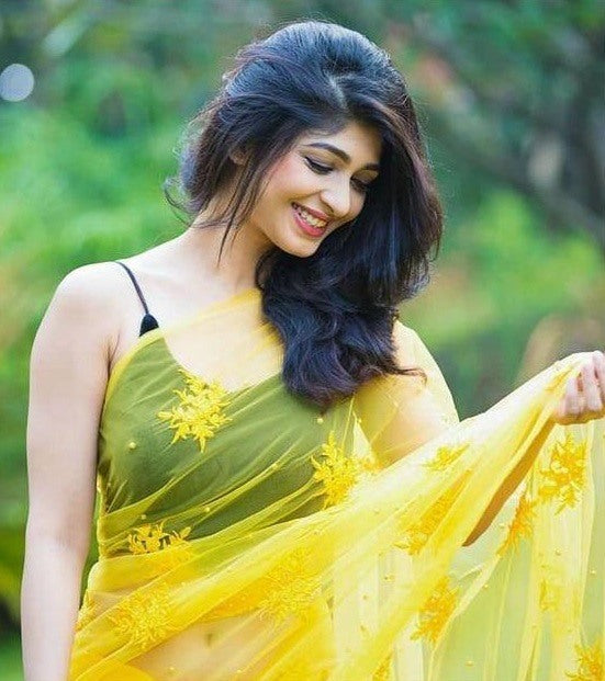 Yellow georgette embroidery and moti work saree