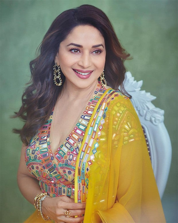 Yellow georgette fancy thread paper mirror work lehenga choli