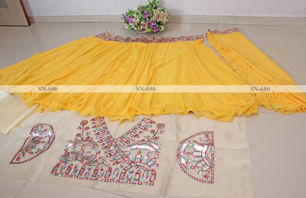 Yellow georgette fancy thread paper mirror work lehenga choli
