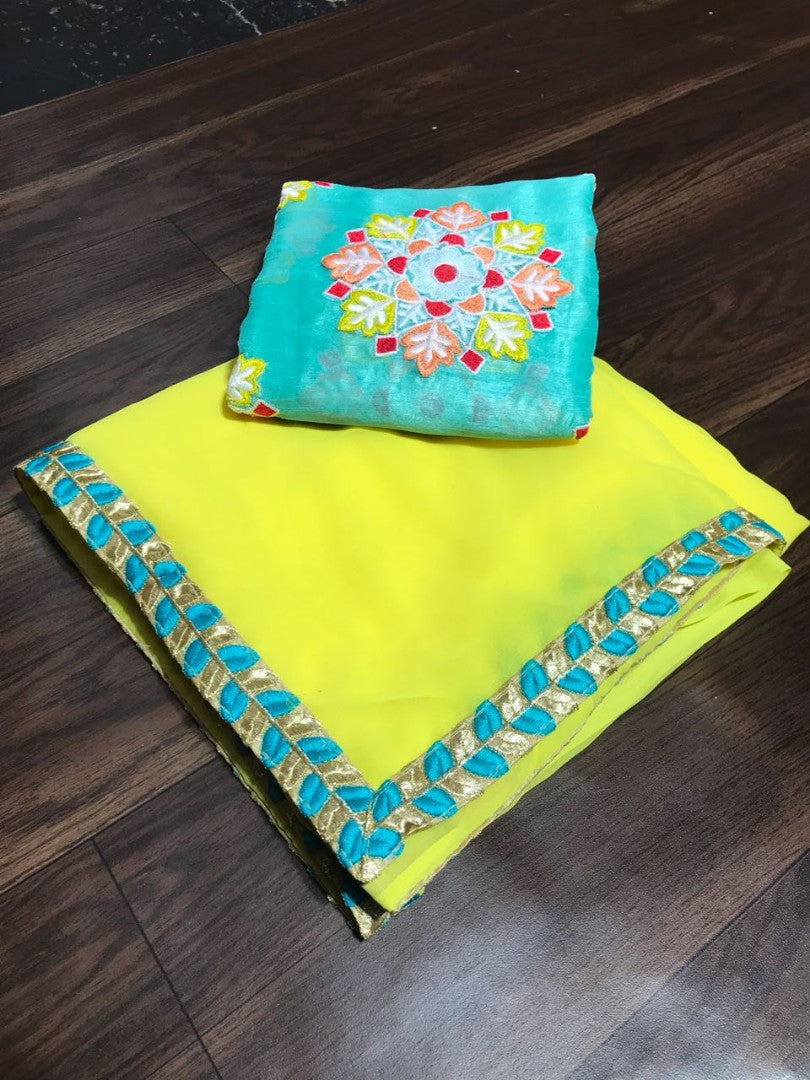 yellow georgette festival wear saree with embroidered blouse