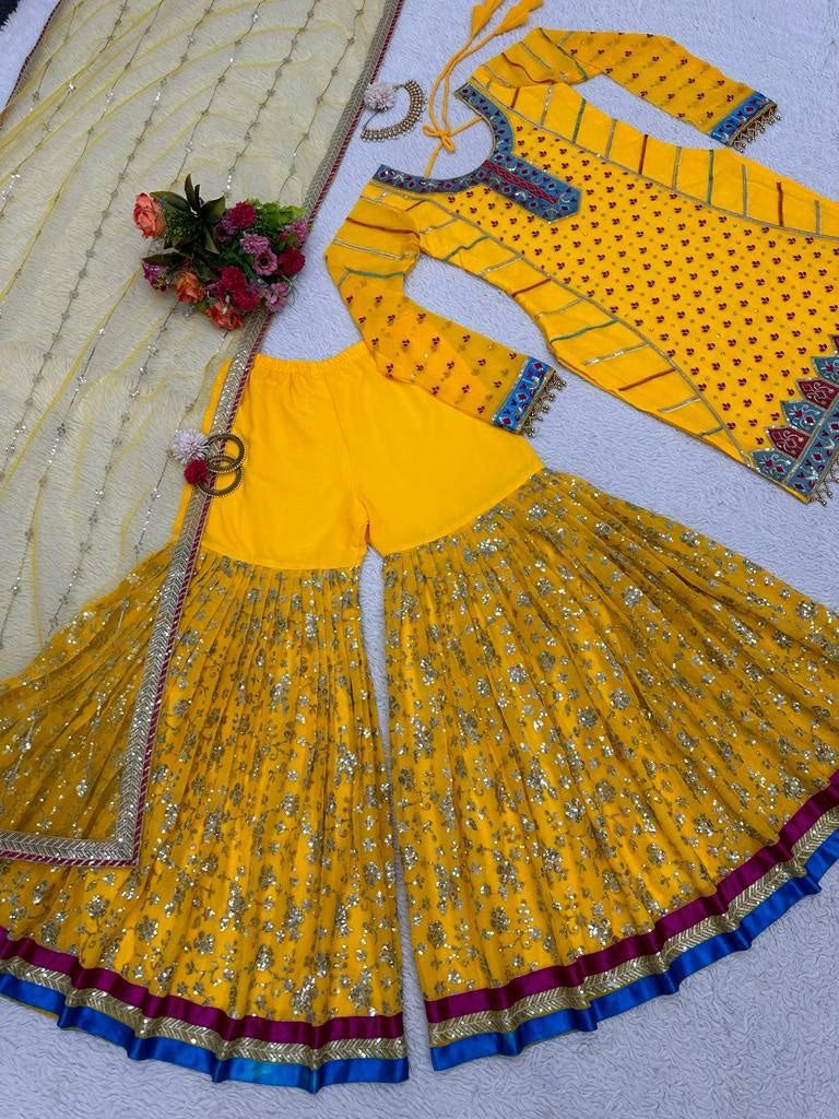 Yellow georgette heavy embroidery work sharara suit for haldi ceremony
